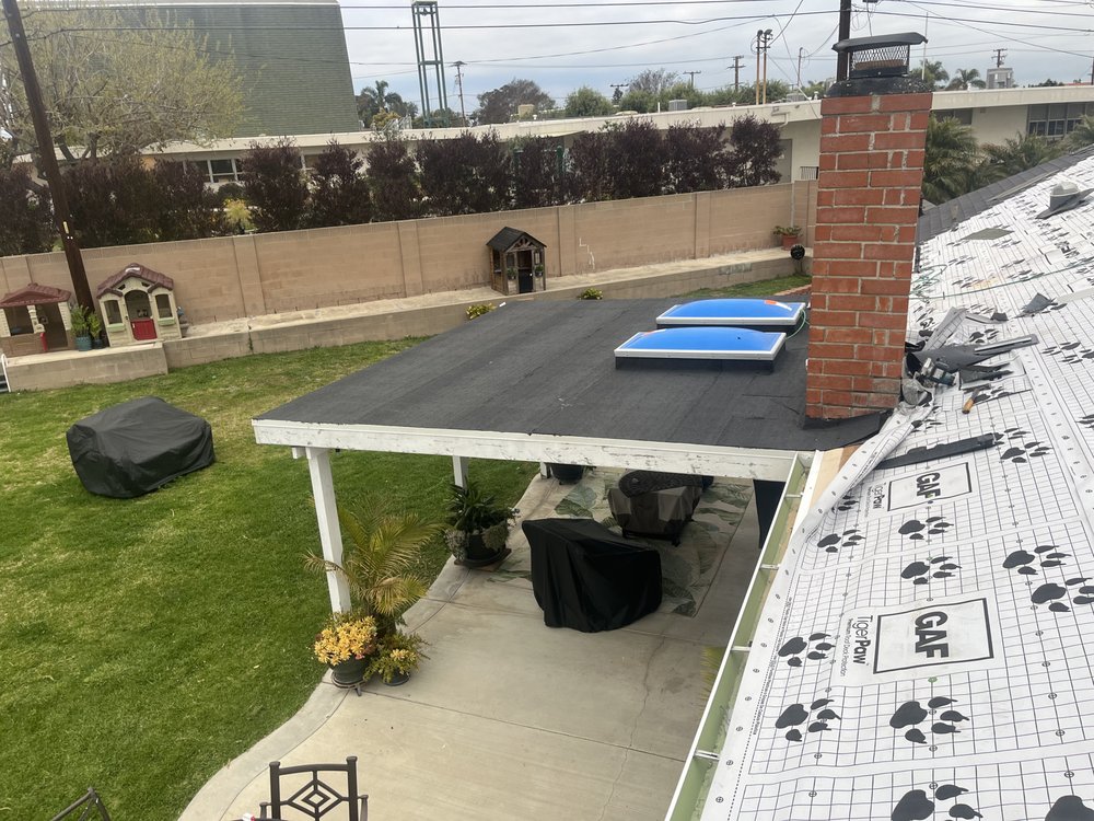 Slide of T’s Roofing 