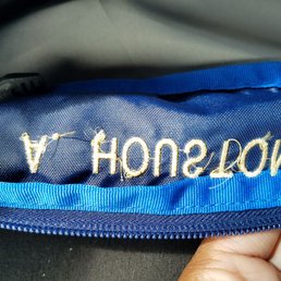 Embroidery almost going into zipper Embroidery almost going into zipper