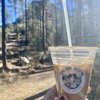 Thumb Butte Coffee - Granite Mountain latte with thumb butte in the background - Coffee Roasteries Near Me