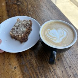 A maple latte with gluten free cinnamon cake. A maple latte with gluten free cinnamon cake.