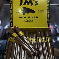 Cali Smokes and Vapes - Open JM's Dominican Corona cigar box with yellow-banded cigars