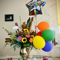 Birthday bouquet with unusual sunflowers and exotic designs. Amazing.