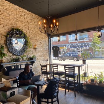 Artistry Coffee - a woman working on her laptop - Coffee & Tea Near Me - Vancouver, British Columbia