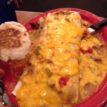 Sam's No 3 - Kitchen sink burrito (with English muffin for size comparison) - Breakfast & Brunch Near Me - Denver, Colorado