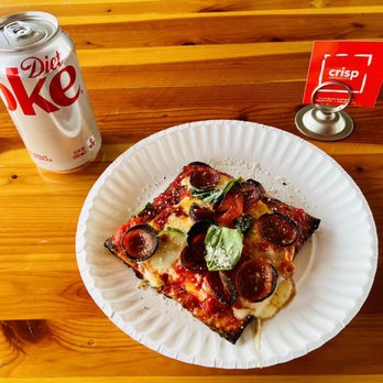 Crisp Premium Pizza - a slice of pizza on a paper plate - Pizza Near Me - Scottsdale, Arizona