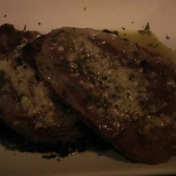Osteria Papavero - Cotoletta ($19) DELICIOUS. Beaten porkchop breaded and panfried in butter with wilted buttery spinach. - Italian Near Me - Madison, Wisconsin