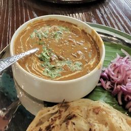Chole bathure , dal makhni and malabar paratha Chole bathure , dal makhni and malabar paratha