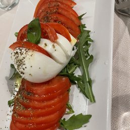 Tomatoes and buffalo caprese salad. We asked for balsamic and it was amazing Tomatoes and buffalo caprese salad. We asked for balsamic and it was amazing
