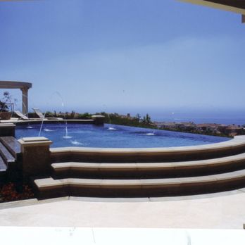 Premier Landscape Division - Raised doubled sided infinity edge mediterranean pool, trickle down water fall facing hous - Landscape Architects or Designers Near Me Premier Landscape Division - Raised doubled sided infinity edge mediterranean pool, trickle down water fall facing hous - Landscape Architects or Designers Near Me