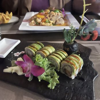 Azuma Sushi Bistro - Dragon roll (minus roe) in the front, wok Thai mango chicken in the back center, crab rangoons back left - Sushi Bars Near Me - Malta, New York