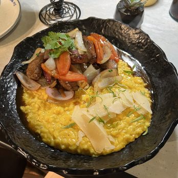 CVI.CHE 105 - Anticuchos delicious beef that was so tender with amazing risotto with shaved cheese on top. Get this! - Peruvian Near Me - Miami, Florida