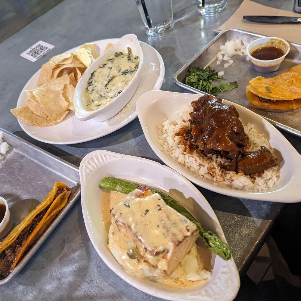 Prospect Park - 2 birria tacos, spinach dip and chips, salmon and mashed potatoes, oxtail with rice - Sports Bars Near Me - Houston, Texas Prospect Park - 2 birria tacos, spinach dip and chips, salmon and mashed potatoes, oxtail with rice - Sports Bars Near Me - Houston, Texas