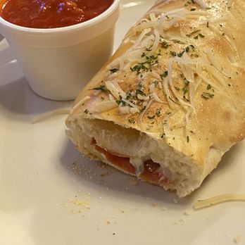 Michelangelo's Pizzeria - Stromboli with pepperoni, salami, and basil. - Pizza Near Me - Clovis, California Michelangelo's Pizzeria - Stromboli with pepperoni, salami, and basil. - Pizza Near Me - Clovis, California