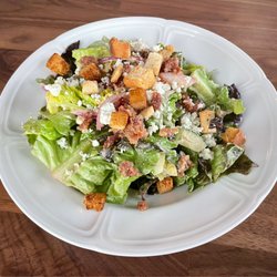 Restaurant Claudine - House salad with crumbled blue cheese, homemade French dressing, and bacon
