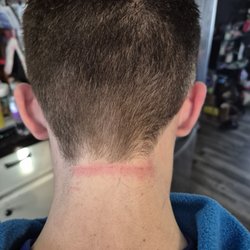 Great Clips - Steph cut his hair way shorter than we asked, and as you can see in the photos, cut up the back off his neck with the clippers.