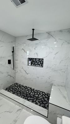Bathroom Remodel - Our shower remodel process starts with a personal consultation to understand your vision, needs, and budget, followed by helping you choose the perfect layout, tile, and fixtures. We carefully prepare the site, removing the old shower and protecting your home before inspecting and updating plumbing as needed. Next, we apply professional-grade waterproofing for long-lasting protection, then install your tile with precise craftsmanship for a flawless finish. Once the tile is complete, we add your chosen fixtures, custom touches like niches or benches, and any glass panels or doors. Finally, we seal and polish everything, clean the space, and walk you through your new shower to ensure every detail exceeds your expectations. Bathroom Remodel - Our shower remodel process starts with a personal consultation to understand your vision, needs, and budget, followed by helping you choose the perfect layout, tile, and fixtures. We carefully prepare the site, removing the old shower and protecting your home before inspecting and updating plumbing as needed. Next, we apply professional-grade waterproofing for long-lasting protection, then install your tile with precise craftsmanship for a flawless finish. Once the tile is complete, we add your chosen fixtures, custom touches like niches or benches, and any glass panels or doors. Finally, we seal and polish everything, clean the space, and walk you through your new shower to ensure every detail exceeds your expectations.