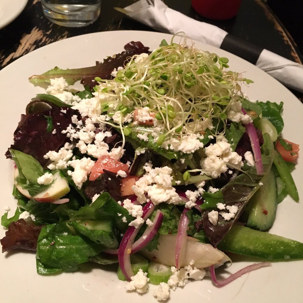 Roots Cafe - Seasonal salad with mixed greens, tomatoes, cucumbers and goat cheese. - New American Near Me - Naples, New York Roots Cafe - Seasonal salad with mixed greens, tomatoes, cucumbers and goat cheese. - New American Near Me - Naples, New York
