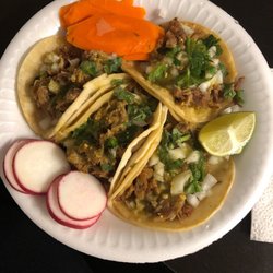 Cortes Tacos - 4 regular Carnitas Tacos with everything. I requested no jalapeño.. heaven on a plate.
