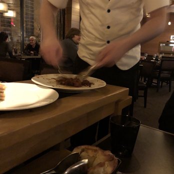 Bourbon Steak - It's tuna tartare being tossed - Steakhouses Near Me - Washington, DC, District of Columbia