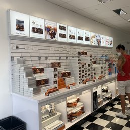 a woman shopping in a store a woman shopping in a store