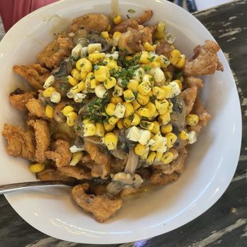 The Wayward Cafe - Infamous bowl: popcorn "chiggen", dill corn, mashed potatoes, mushroom gravy and vegan cheddar "cheeze" sauce. Delicious! - Breakfast & Brunch Near Me - Seattle, Washington