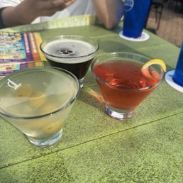 Trifecta of drinks. Expresso martini, cosmopolitan and a dirty martini Trifecta of drinks. Expresso martini, cosmopolitan and a dirty martini