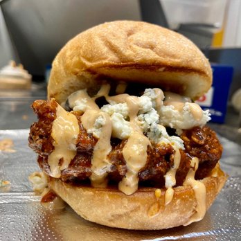 Fire Chicken Sandwiches - a close up of a chicken sandwich - Chicken Shop Near Me - Ashtabula, Ohio Fire Chicken Sandwiches - a close up of a chicken sandwich - Chicken Shop Near Me - Ashtabula, Ohio