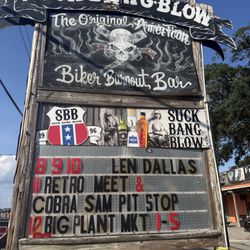 Suck Bang Blow - Sign out front