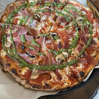 Just Tap'd - San marzano sauce Mozzarella Prosciutto and mushrooms and tomatoes Pesto drizzle. - Beer, Wine & Spirits Near Me - Macon, Georgia Just Tap'd - San marzano sauce Mozzarella Prosciutto and mushrooms and tomatoes Pesto drizzle. - Beer, Wine & Spirits Near Me - Macon, Georgia