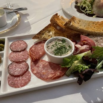 La Ferme - Assorted salted meat plate with meat pie, toasted bits, gherkin pickles, olives, and stone ground mustard. - French Near Me - Chevy Chase, Maryland