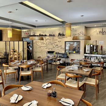 Dunhuang - a dining area with tables and chairs - Chinese Near Me - Edison, New Jersey Dunhuang - a dining area with tables and chairs - Chinese Near Me - Edison, New Jersey