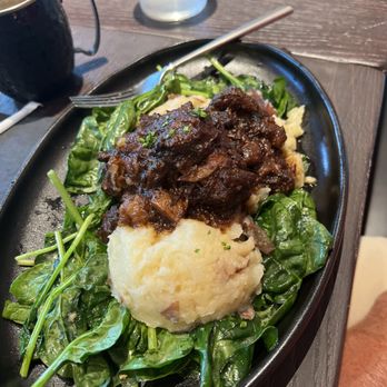Honey Uninhibited - Covington - Oxtail with mashed potatoes and sautéed spinach - Breakfast & Brunch Near Me - Covington, Kentucky