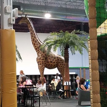 Lava Island - Food court and front part of Play area.  Nice giraffe - Trampoline Parks Near Me - Aurora, Colorado