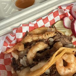 Weird over cooked shrimp and dry meat.