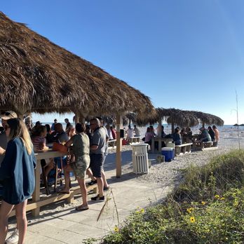 Lido Key Tiki Bar - a group of people sitting at a tiki bar - Tiki Bars Near Me - Sarasota, Florida Lido Key Tiki Bar - a group of people sitting at a tiki bar - Tiki Bars Near Me - Sarasota, Florida