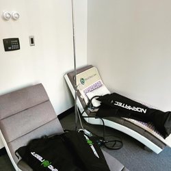 Healthy Therapeutics Medical Practice - Leg Compression recovery area, yoga mat