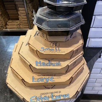 Round Table Pizza - a stack of pizza boxes - Pizza Near Me - Redondo Beach, California Round Table Pizza - a stack of pizza boxes - Pizza Near Me - Redondo Beach, California