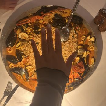 Aurora Restaurant & Bar - Huugeee paella- hand for size reference lol - Mediterranean Near Me - Old Tappan, New Jersey