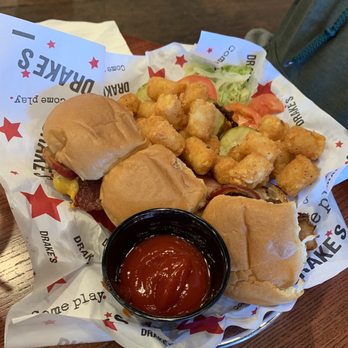Drake's - Mini cheeseburgers & tots with burger toppings hidden under the tots. - Beer Bar Near Me - Jeffersonville, Indiana Drake's - Mini cheeseburgers & tots with burger toppings hidden under the tots. - Beer Bar Near Me - Jeffersonville, Indiana
