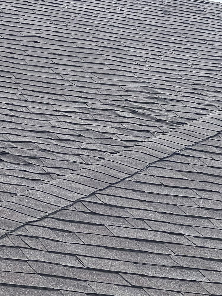 Slide of Tucker Roofing Systems