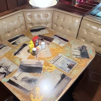 Hut Inn - Lots of these large booths - table art remembers Wreck of Edmund Fitzgerald - American Near Me - Calumet, Michigan