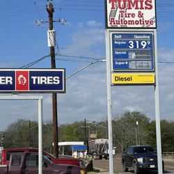 Tumis Mobil Service Station - Street sign of Tumis Tire