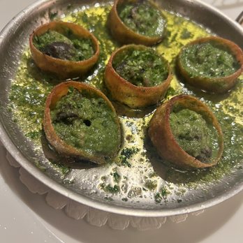 Le Crocodile Restaurant - Snails Baked in Pastry Shells $24 served with garlic butter - French Near Me - Vancouver, British Columbia