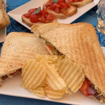 Caffè Caso - Ham, mozzarella, tomato, and salad sandwich with bruschetta. - Cafes Near Me - Capri, NA