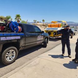 Blue Angels Roadside Service - Ricardo is finishing up my boat tire replacement in record time after a Blowout in 120°+ heat.