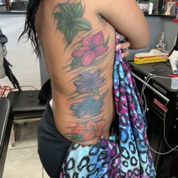 Zoe's Tattoo and Piercings