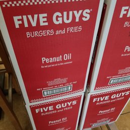 two boxes of five guys burgers and fries