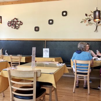 Samburna Indian Restaurant - two women sitting at a table - Indian Near Me - Bothell, Washington Samburna Indian Restaurant - two women sitting at a table - Indian Near Me - Bothell, Washington