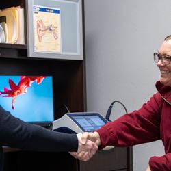 Amplex Hearing Aids - Shaking hands with the doctor after hearing again