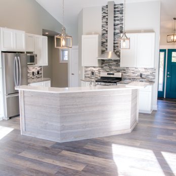 Parker's Custom Builders - a kitchen with a center island - General Contractors Near Me - Whaitehall, Michigan Parker's Custom Builders - a kitchen with a center island - General Contractors Near Me - Whaitehall, Michigan